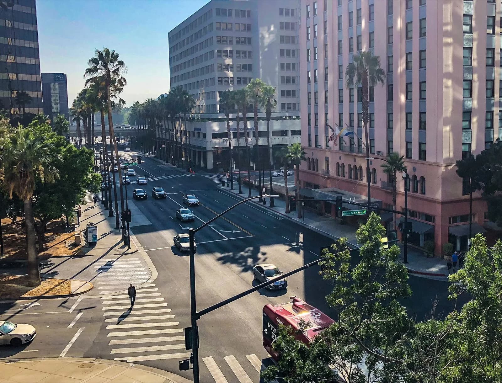 Downtown San Jose traffic at East Santa Clara Street and Notre Dame Avenue, with crosswalks and a VTA bus.